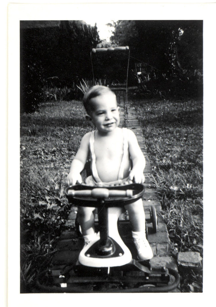 Little Ricky puts the Taylor-tot through the straightaway at The Brickyard, 1948. I've got my "I like Ike" hairstyle going.