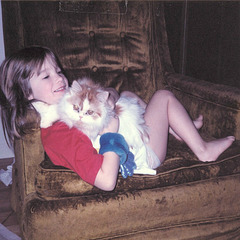 Emily and one of our cats. 1986