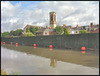 St Barnabas behind the fence