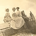 Summer! My grandmother (c) atop some storm-damaged flotsam on Lake Michigan shore, c. 1903