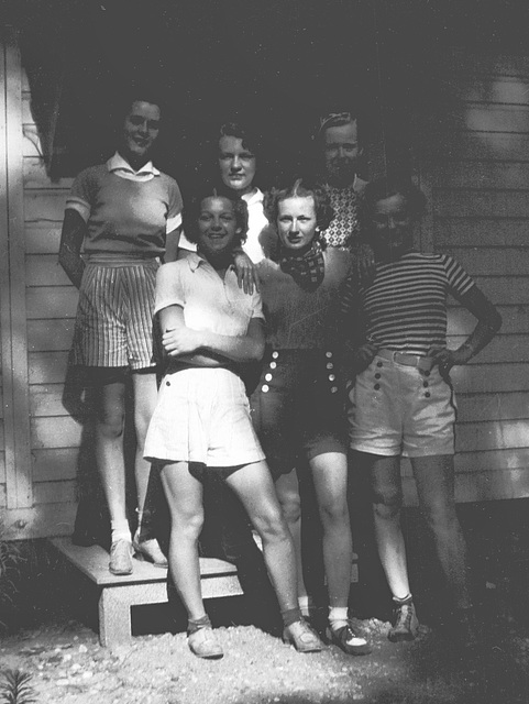 Dad's sister, Doris (top left), with friends behind the lake cottage. C. 1938.