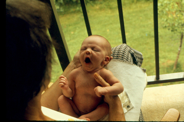 Taking an "air bath" on grandma's lap while singing the final measures of Puccini's "Un Bel Di Vedremo" . Showing great promise, August, 1974.