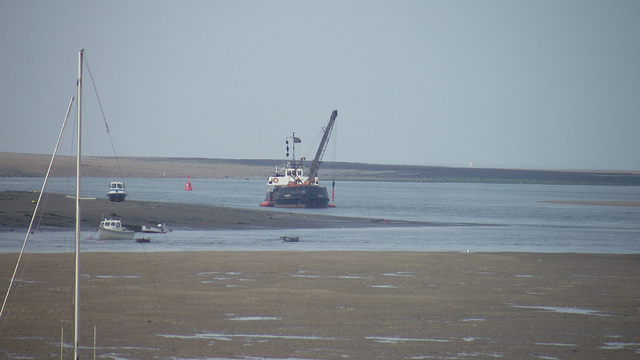 The dredger digging a deeper channel