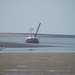 The dredger digging a deeper channel