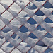 Winter pattern on orange fence