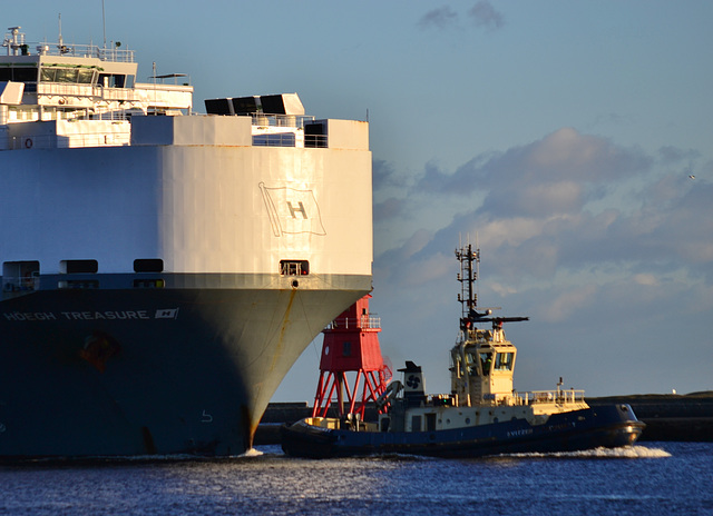 Guided in by tug and pilot