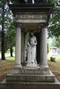 A Funerary Monument with a Statue of a Creepy Victorian Woman in Woodlawn Cemetery, August 2008