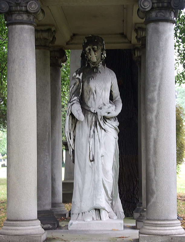 Detail of a Funerary Monument with a Statue of a Creepy Victorian Woman in Woodlawn Cemetery, August 2008