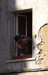 Man in a Window in the Building Facing the Piazza della Scala in Trastevere, June 2012