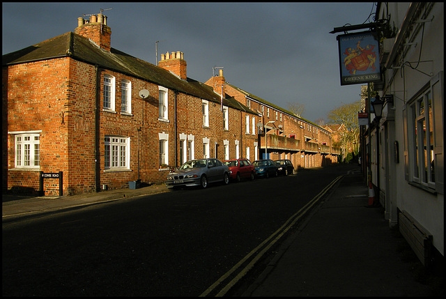 sunlit brick against a dark sky