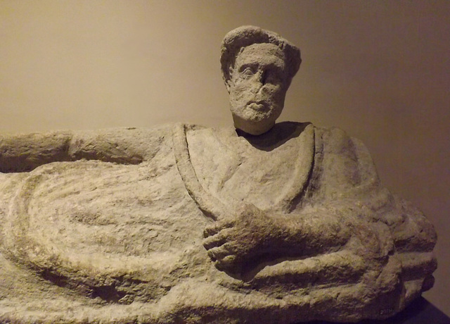 Detail of an Etruscan Nenfro Sarcophagus of a Reclining Man from Orte in the Vatican Museum, July 2012