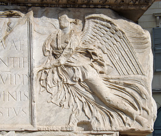 Detail of one of the Victories on the Base of the Column of Trajan in Rome, July 2012