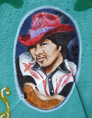 Detail of a Cowboy from a Mural in a Parking Lot on Steinway Street in Astoria, May 2010