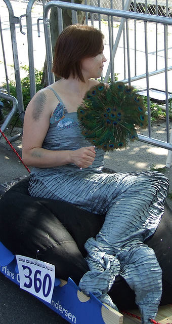 Mermaid with a Peacock Feather Fan at the Coney Island Mermaid Parade, June 2010