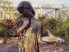 Bronze Sculpture of a Girl Holding a Sundial in the Rose Garden of the Brooklyn Botanic Garden, Nov. 2006