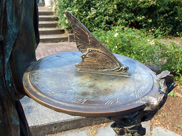 Detail of the Bronze Sculpture of a Girl Holding a Sundialin the Rose Garden in the Brooklyn Botanic Garden, July 2008