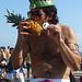 A Guy Eating a Pineapple at the Coney Island Mermaid Parade, June 2008