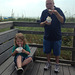 Kolton eating ice cream with Papa at the beach
