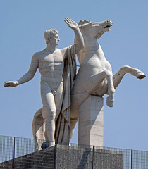 Sculpture of one of the Dioscuri in front of the Palazzo Della Civilta Italiana in EUR in Rome, July 2012