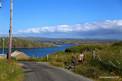 Summer visitors out for a walk on the track overlooking Pabhay and the Reef Islands