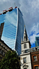 the walkie talkie looming over the spire of wren's st.margaret pattens, london