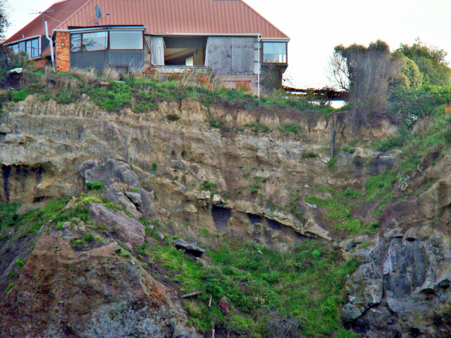 Abandoned house on cliff edge, Sumner