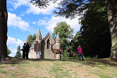 Tourists admiring The Mausoleum at Scone Palace, built on the mound or "Moot Hill" on which Scottish kings were crowned