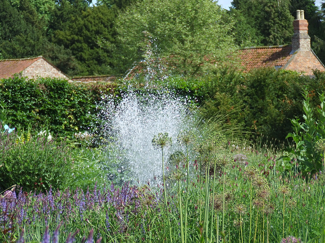 Fountain in flower garden