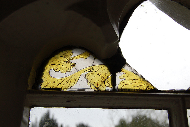 Wrentham Hall. Interior. RF6. East wall stained glass and damaged panel