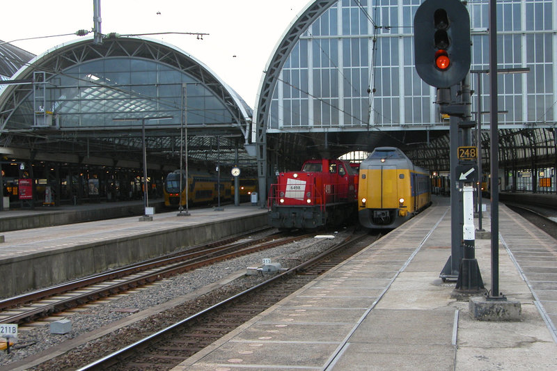 Railion 6498, 6499 and 6496 pulling a goods train through Amsterdam Central station