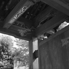 Slips of paper posted on the ceiling of the temple gate