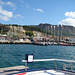 The port of Cassis with nearby limestone cliffs.