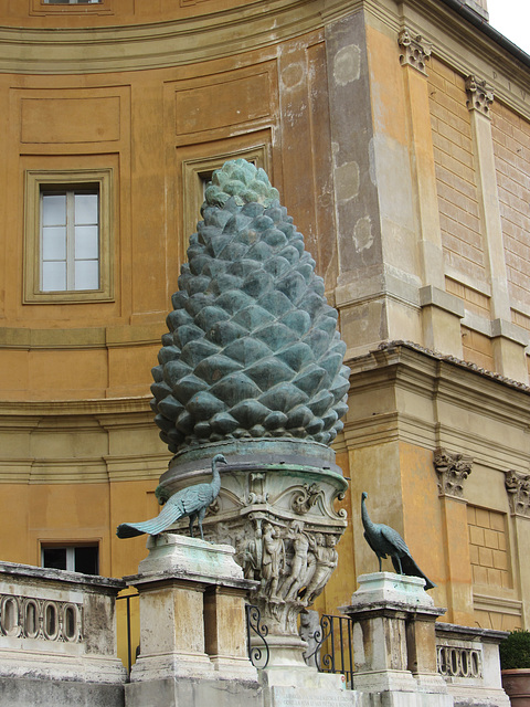 This bronze pine cone once part of an ancient Roman fountain near the Temple of Isis but is now a focal point of the highest terrace in the Vatican.  The bronze peacocks were taken from Hadrian's maus