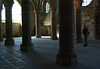 Stone columns with tourist - Arcades at Mont St Michel - September 2011