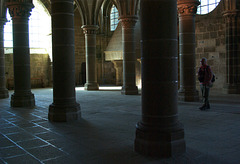 Stone columns with tourist - Arcades at Mont St Michel - September 2011