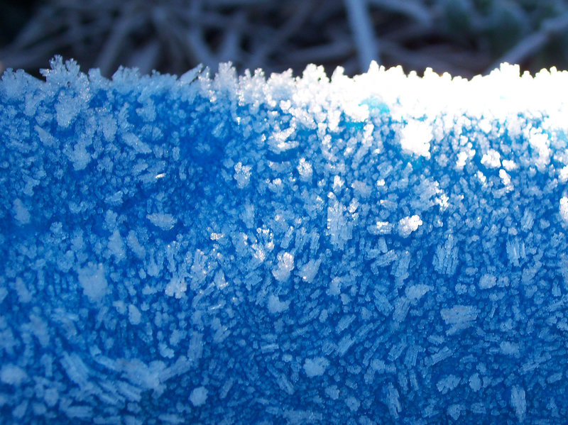 Ice crystals on a  blue tarpaulin