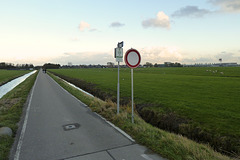 Bicycle route straight ahead, but prohibited for all traffic