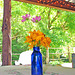 Flowers in a Blue Bottle