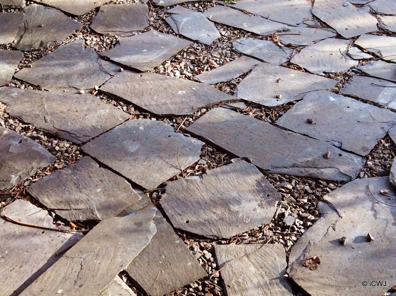 Old slates make good flooring in a garden gazebo