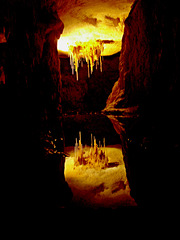 stalactites reflected in pool