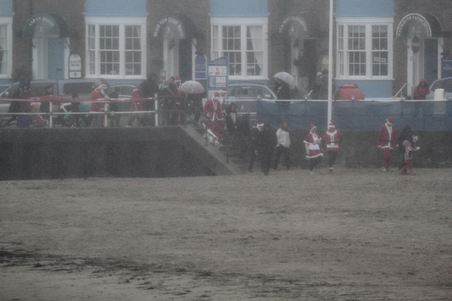 Weather was atrocious as the Santas filed out for the start