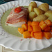 Cod loin with Parma ham and a pea and mint sauce.