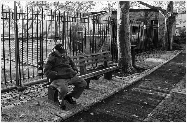 Sitting on the bench.