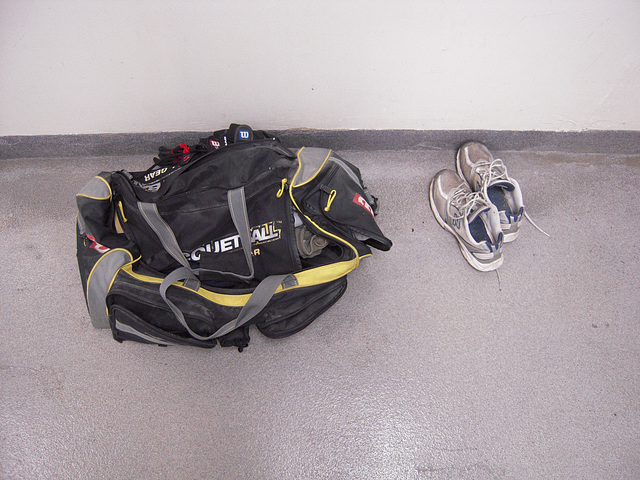 still life with gym bag and old shoes