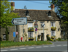 Greyhound pub with road signs