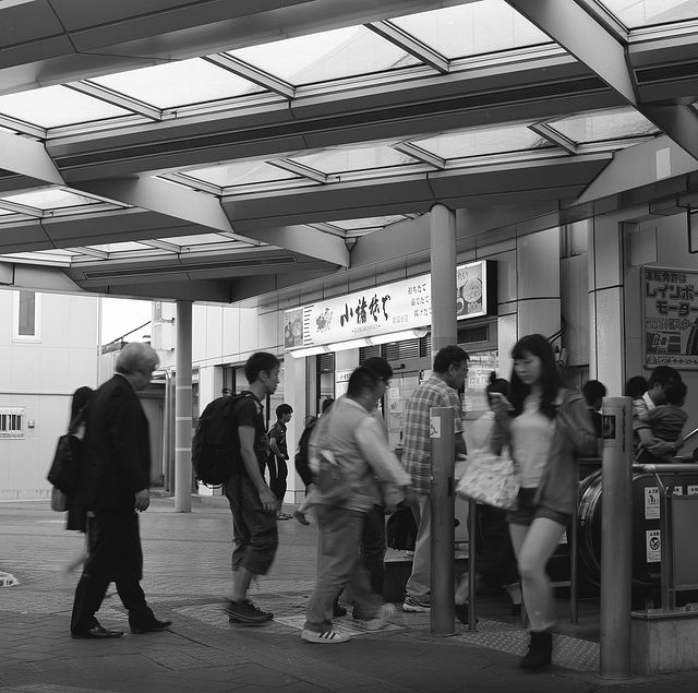 Passengers climbing on an escalator