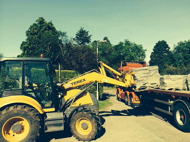 Peter, operating his forklift with all the precision of a brain surgeon...