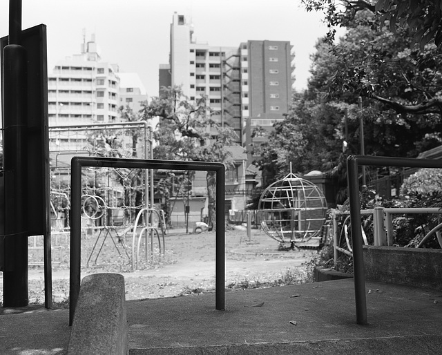 Playground surrounded by tall buildings