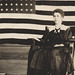 Woman on Rocking Chair with Flag