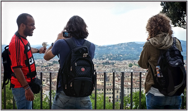 The three friends photographing their pet in Florence.